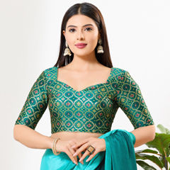 Green color Blouse in Brocade fabric with Weaving work