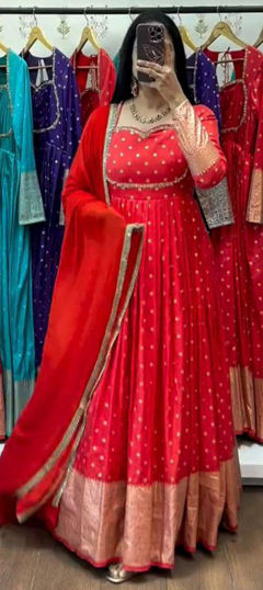 Red and Maroon color Gown in Jacquard fabric with Weaving work
