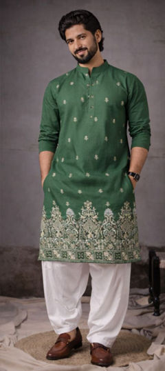 Green color Kurta Pyjamas in Silk fabric with Embroidered work
