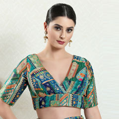 Green color Blouse in Brocade fabric with Weaving work