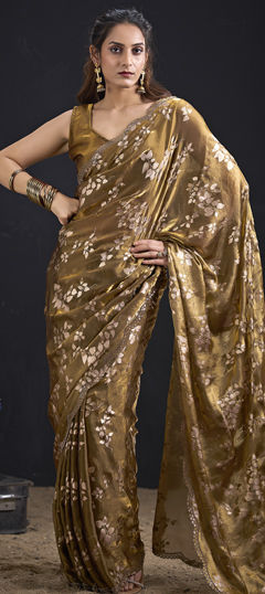 Gold color Saree in Tissue fabric with Zircon work