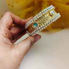 Gold Rodium Polish White and Off White color Bracelet in Brass studded with Pearl