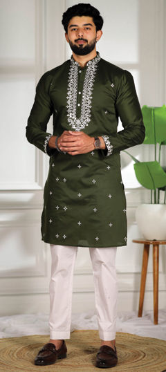 Green color Kurta Pyjamas in Cotton fabric with Embroidered work