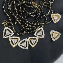 Gold Rodium Polish White and Off White color Pendant in Brass studded with Austrian diamond