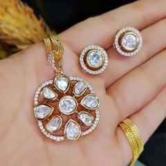 Gold Rodium Polish White and Off White color Pendant in Brass studded with Austrian diamond