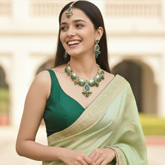 Gold Rodium Polish Green color Necklace in Brass studded with Kundan