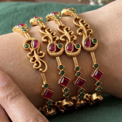 Gold Rodium Polish Green color Bangles in Brass studded with CZ Diamond