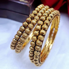 Gold Rodium Polish Gold color Bangles in Metal Alloy studded with CZ Diamond