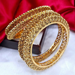 Gold Rodium Polish Gold color Bangles in Metal Alloy studded with Artificial