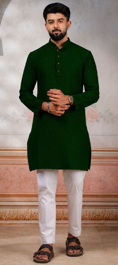 Green color Kurta Pyjamas in Cotton fabric with Weaving work