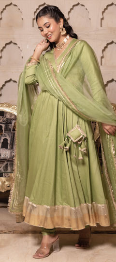 Green color Salwar Kameez in Silk fabric with Lace work