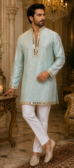 Blue color Kurta Pyjamas in Tissue fabric with Mirror work