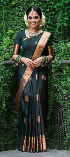 Green color Saree in Banarasi Silk fabric with Weaving work