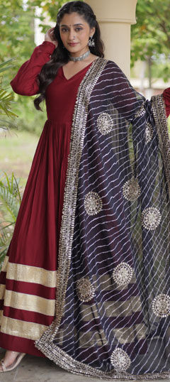 Red and Maroon color Gown in Rayon fabric with Border work