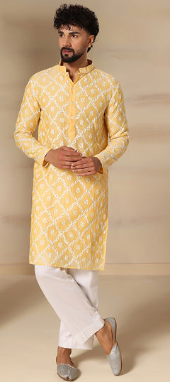 Yellow color Kurta Pyjamas in Chanderi fabric with Embroidered work
