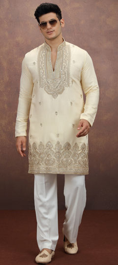 Gold color Kurta Pyjamas in Art Silk fabric with Embroidered work