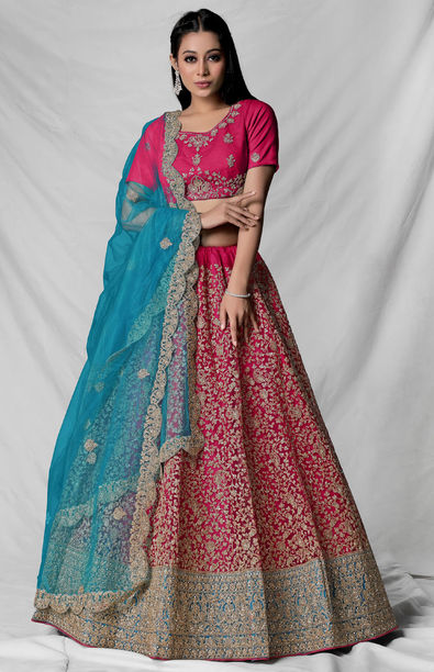 Photo of Bridal portrait with light pink lehenga and blue embroidery with  ombre dupatta