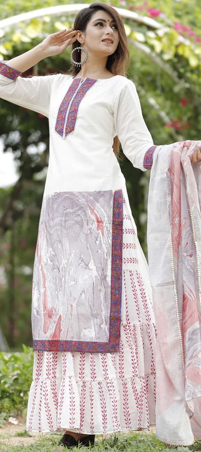 White salwar kameez shop with pink dupatta