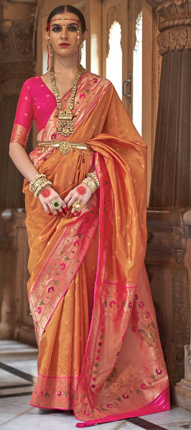 In a bridal look in orange color pattu / kanjeevaram saree, short sleeve  blouse design, hip … | Indian bridal fashion, South indian wedding saree,  Indian photoshoot